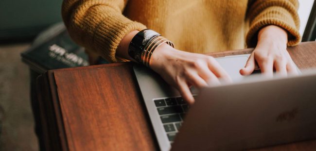 christin-hume-Hcfwew744z4-unsplash-1-1-scaled-(1) Photo of hands typing on a laptop