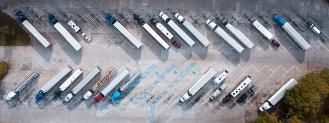 SCCM-to-Intune-Migration-01 Aerial view of trucks parking looking quite abstract.